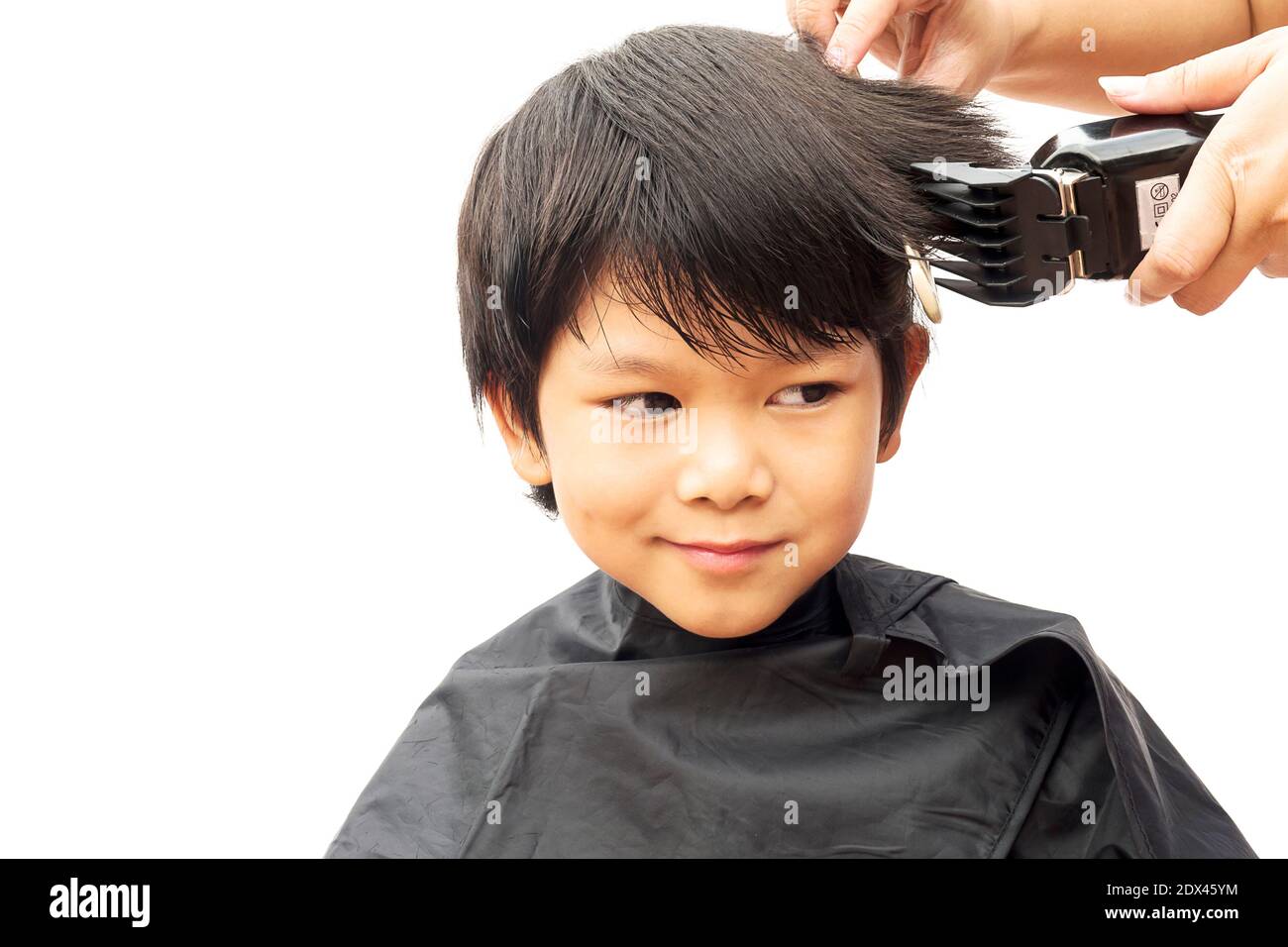 Smiling Boy Getting Hair Cut Against White Background Stock Photo - Alamy Smiling Boy Getting Hair Cut Against White Background Stock Photo - Alamy