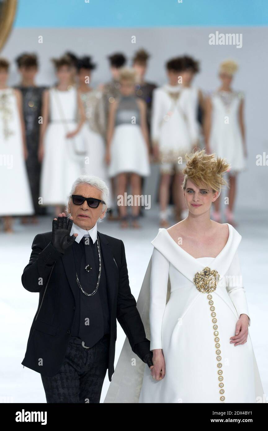 Designer Karl Lagerfeld walks the runway with pregnant model