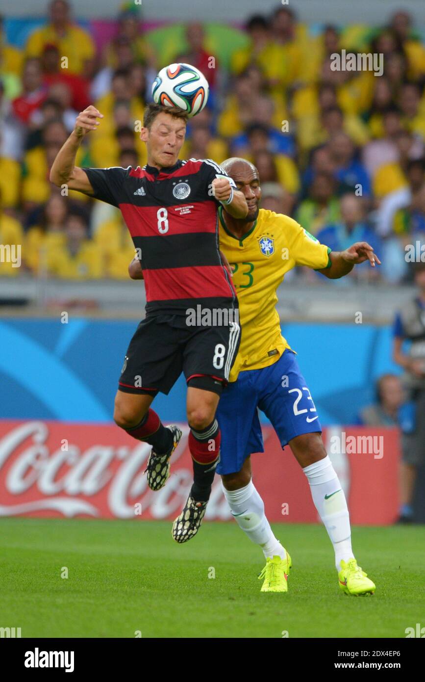 Brazil's Maicon battling Germany's Mesut Ozil in Soccer World Cup 2014 1/2 Final match Brazil vs Germany at Mineiro Stadium, Belo Horizonte, Brazil on July 8, 2014. Germany won 7-1 . Photo by Henri Szwarc/ABACAPRESS.COM Stock Photo
