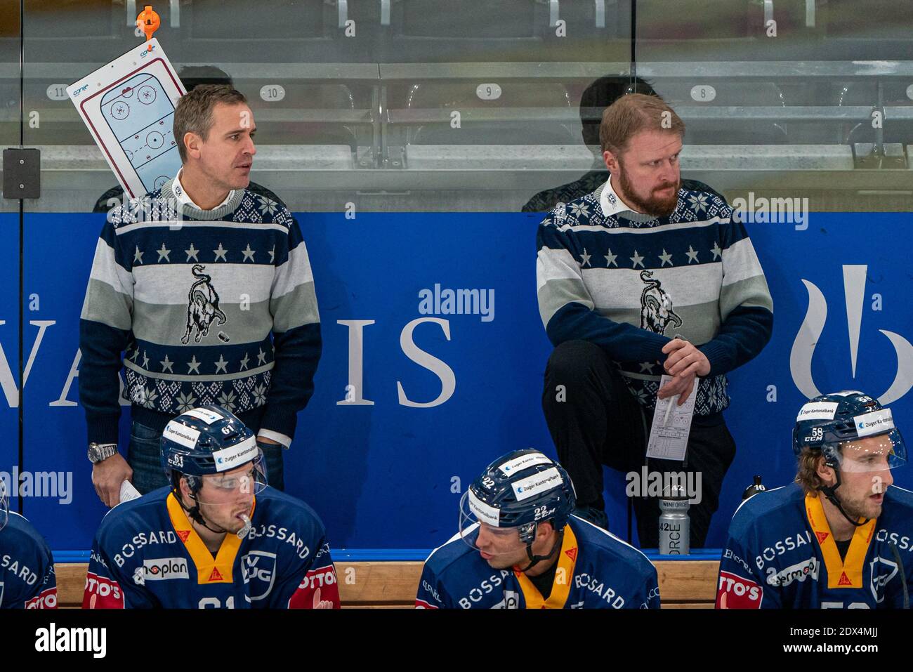 Zug, Switzerland. 23rd Dec 2020. Head Coach Dan Tangnes (EV Zug) and  Assistant Coach Klas Oestman (EV Zug) during the National League Regular  Season ice hockey game between EV Zug and SCL
