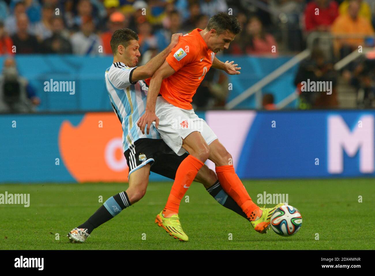 Netherlands's Robin van Persie battling Argentina's Martin Demichelis during Soccer World Cup Semi Final match Netherlands v Argentina at Itaquera Stadium, Sao Paulo, Brazil on July 9, 2014. Argentina won on the penalty shoot-out 5-3 after a 0-0 score. Photo by Henri Szwarc/ABACAPRESS.COM Stock Photo