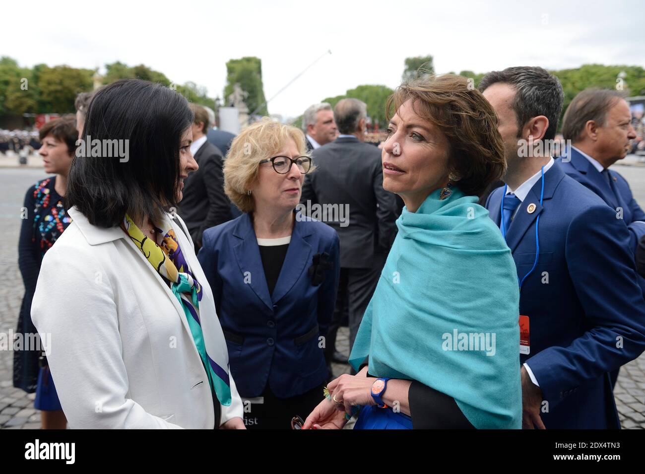 French Minister for Equality of Territories and Housing, Sylvia Pinel, French Junior Minister for Higher Education and Research Genevieve Fioraso and French Social Affairs and Health Minister Marisol Touraine.French President Francois Hollande and the government attend the annual Bastille Day military parade on the Place de la Concorde Paris, France, July 14, 2014. Photo by Jacques Witt/ Pool/ ABACAPRESS.COM Stock Photo