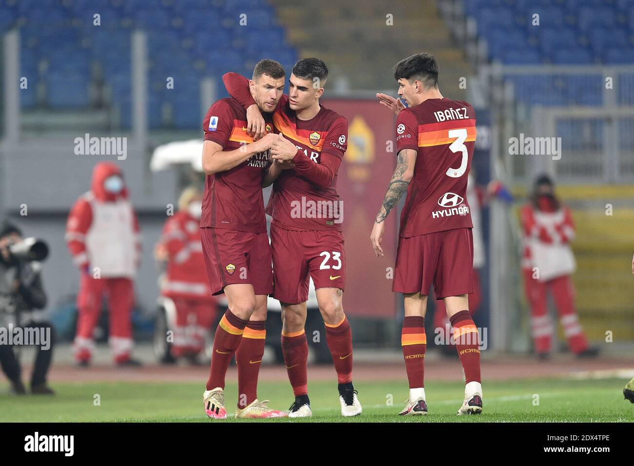 Rome, Italy. 23rd Dec, 2020. ROME, ITALY - December 23 : Edin Dzeko (L ) of AS Roma celebrates with his Gialluca Mancini (C) after scoring a goal during Italian Serie A soccer match between AS Roma and Cagliari at Stadio Olimpico on December 23, 2020 in Rome Italy /LM Credit: Claudio Pasquazi/LPS/ZUMA Wire/Alamy Live News Stock Photo