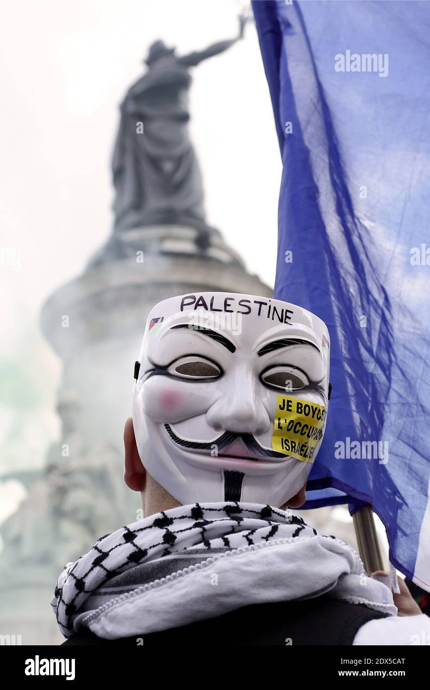 A Pro Palestinian Demonstrator Wears A Anonymous Mask Reading I Boycott The Israeli Occupant On The Republique Square In Paris Ahead Of A Banned Demonstration Against Israel S Military Operation In Gaza And A Pro Palestinian Demonstrator Wears A Anonymous Mask Reading I Boycott The Israeli Occupant On The Republique Square In Paris Ahead Of A Banned Demonstration Against Israel S Military Operation In Gaza And