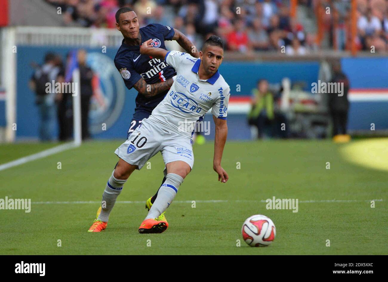 PSG's Gregory van der Wiel sports a tattoo in his neck as he