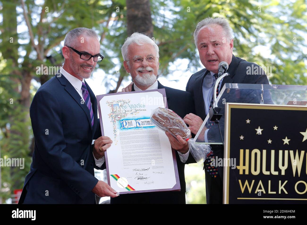 Hollywood Chamber of Commerce President/CEO Leron Gubler , Phil Hartman's  brother John Hartman and Tom LaBonge are seen as Phil Hartman is honored  with a Star on the Hollywood Walk of Fame,, image size:1300x956