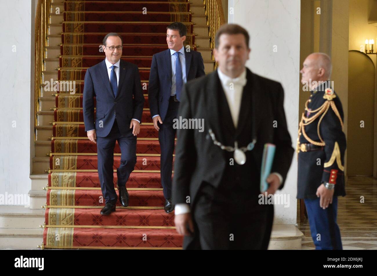 President Francois Hollande and Prime Minister Manuel Valls leave after the weekly cabinet meeting at the Elysee presidential palace in Paris, France, August 27, 2014. Hollande installed a former Banker Emmanuel Macron, a 36-year-old ex-Rothschild banker and architect of the president's economic policy. Photo Thierry Orban/ABACAPRESS.COM Stock Photo