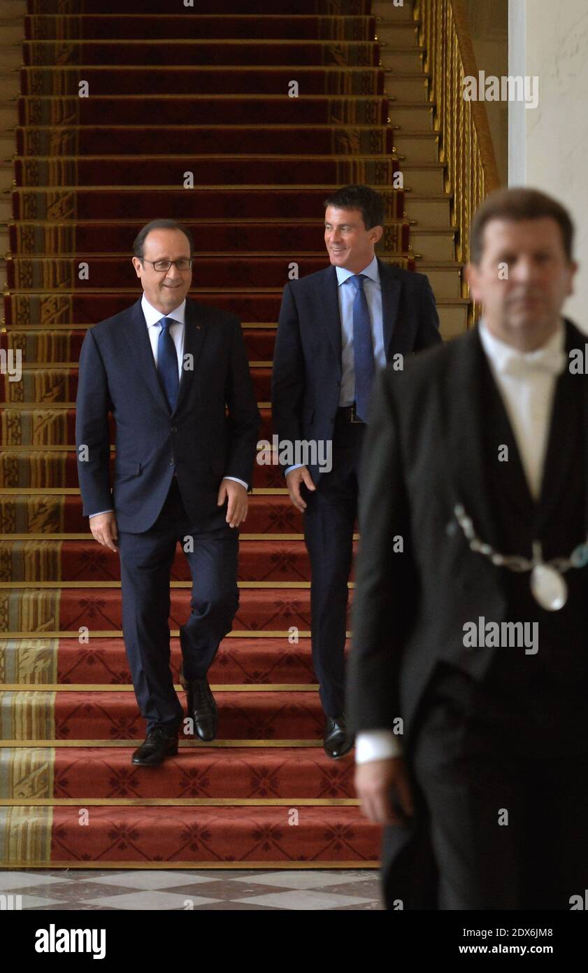 President Francois Hollande and Prime Minister Manuel Valls leave after the weekly cabinet meeting at the Elysee presidential palace in Paris, France, August 27, 2014. Hollande installed a former Banker Emmanuel Macron, a 36-year-old ex-Rothschild banker and architect of the president's economic policy. Photo Thierry Orban/ABACAPRESS.COM Stock Photo
