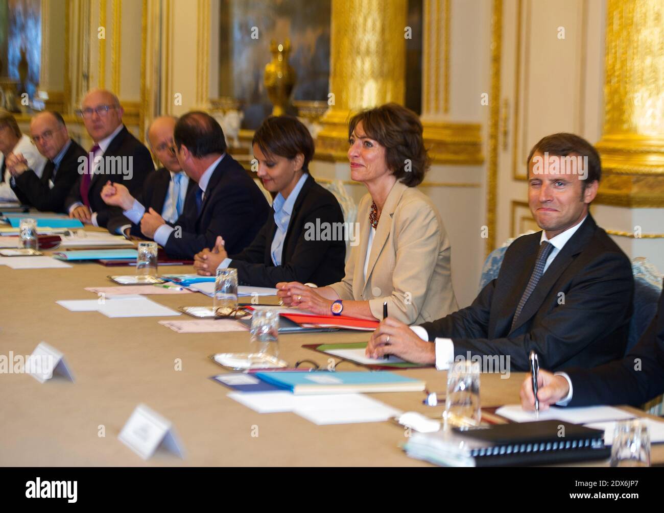 President Francois Hollande, Najat Vallaud-Belkacem, Marisol Touraine and Emmanuel Macron attend the weekly cabinet meeting at the Elysee presidential palace in Paris, France, August 27, 2014. Hollande installed a former Banker Emmanuel Macron, a 36-year-old ex-Rothschild banker and architect of the president's economic policy. Photo Thierry Orban/ABACAPRESS.COM Stock Photo