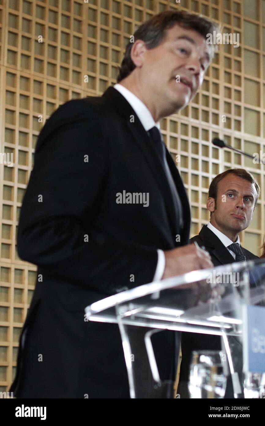 Outgoing French Economy Minister Arnaud Montebourg and his newly appointed successor Emmanuel Macron, a 36-year-old ex-Rothschild banker and architect of the president's economic policy, during a handover cermony in Paris, France on August 27, 2014 at the Economy Ministry. Photo by Stephane Lemouton/ABACAPRESS.COM Stock Photo