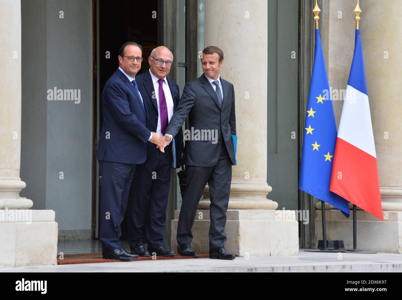 President Francois Hollande, French Finance Minister Michel Sapin and newly-appointed Economy Minister Emmanuel Macron leaving the Elysee presidential palace in Paris, France after a weekly cabinet meeting. French President Francois Hollande on August 27 installed a former banker and ally as economy minister in an emergency reshuffle seen as the 'last chance' to haul France out of the biggest crisis of his presidency. Hollande caught everyone off guard with the appointment of Emmanuel Macron, a 36-year-old ex-Rothschild banker and architect of the president's economic policy. Photo by Christia Stock Photo