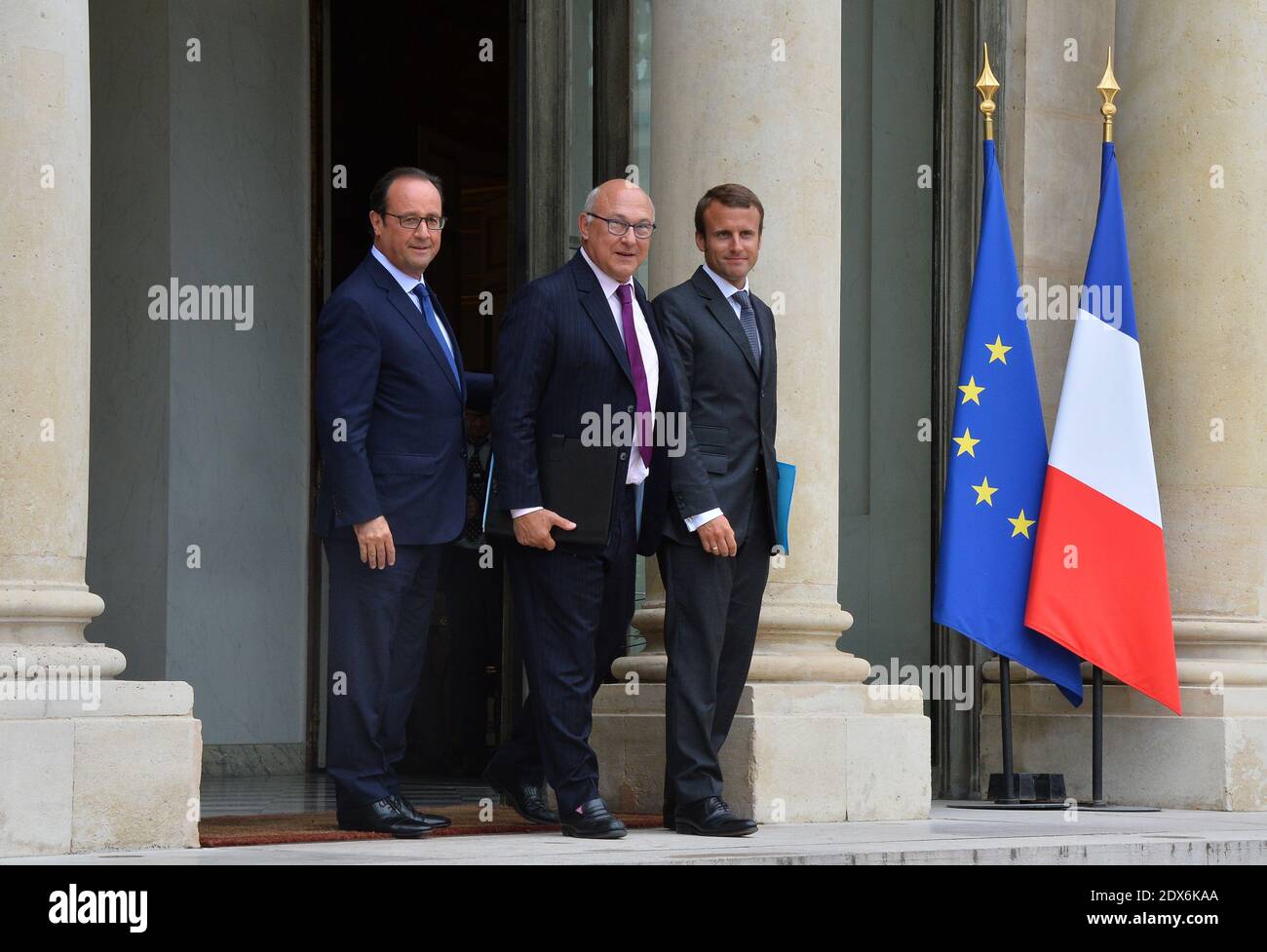 President Francois Hollande, French Finance Minister Michel Sapin and newly-appointed Economy Minister Emmanuel Macron leaving the Elysee presidential palace in Paris, France after a weekly cabinet meeting. French President Francois Hollande on August 27 installed a former banker and ally as economy minister in an emergency reshuffle seen as the 'last chance' to haul France out of the biggest crisis of his presidency. Hollande caught everyone off guard with the appointment of Emmanuel Macron, a 36-year-old ex-Rothschild banker and architect of the president's economic policy. Photo by Christia Stock Photo