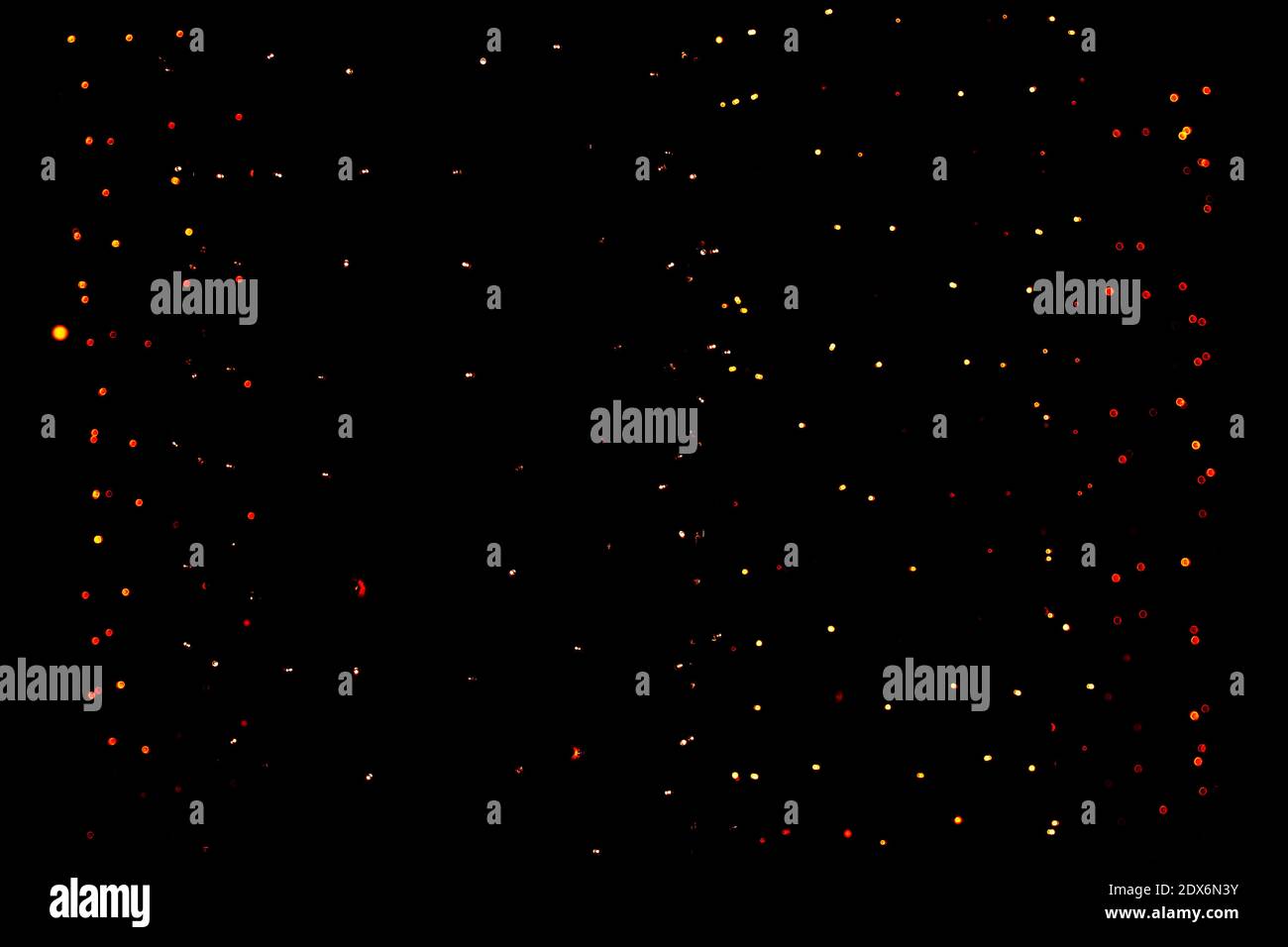 Defocused light dots black background. blurred abstract pattern, bokeh background. Stock Photo