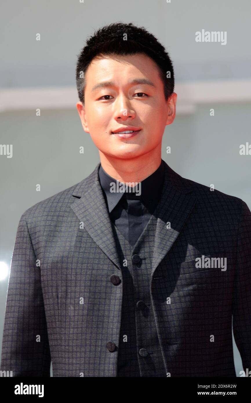 Tong Dawei attending the Qin'Ai De Premiere during the 71st