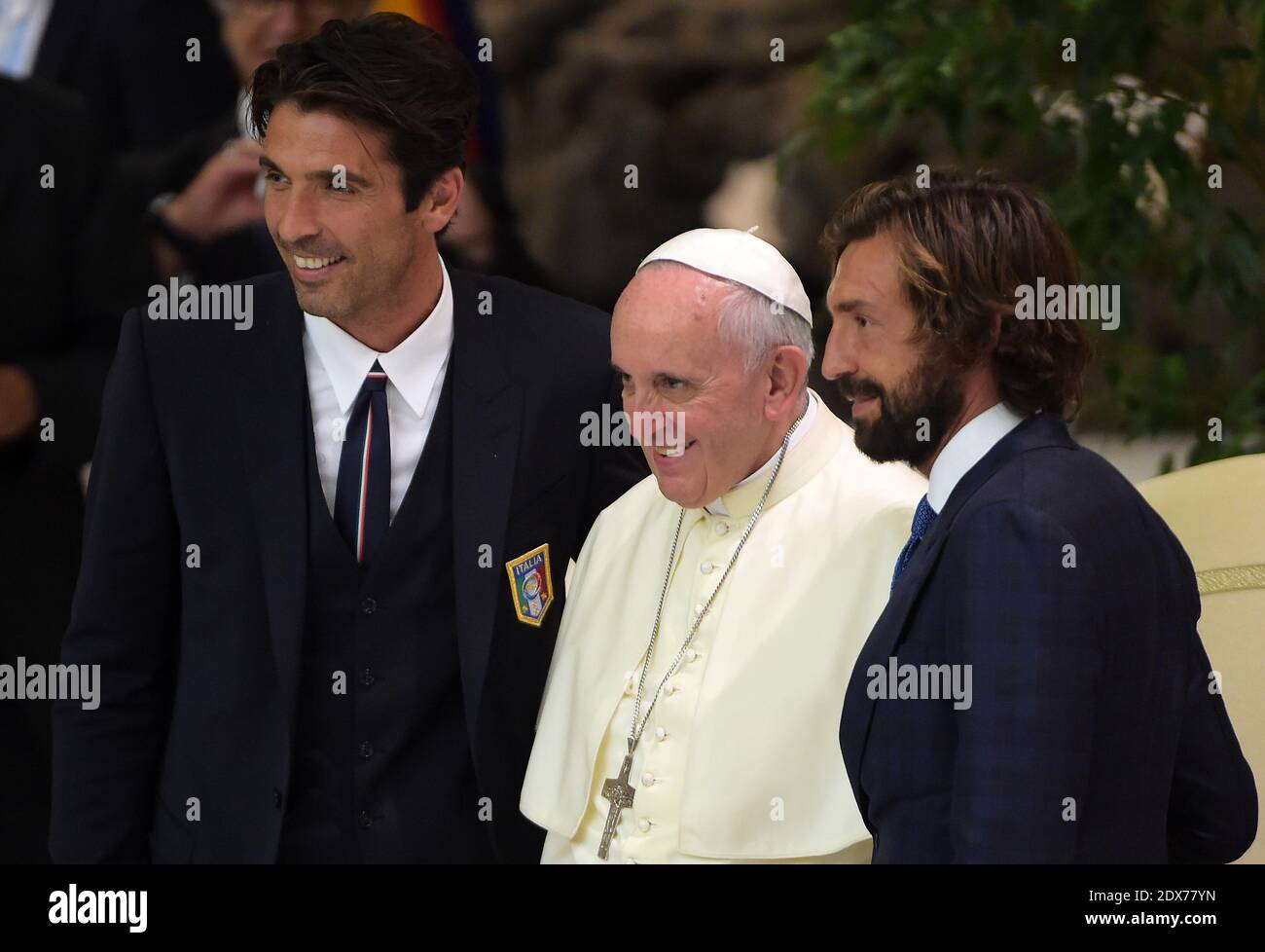 Italian soccer players Gianluigi Buffon and Andrea Pirlo pose with Pope Francis during a special audience at the Vatican on September 1, 2014 for players and organisers of a charity soccer match that was being played in Rome to promote peace and inter-religious cooperation. Pope Francis read an address to the participants in the Vatican's large audience hall and then each of them filed past the pontiff to greet and have their picture taken with him. Maradona chatted with his compatriot longer than most of the others and gave him a light blue-and-white jersey with his Argentine national team nu Stock Photo