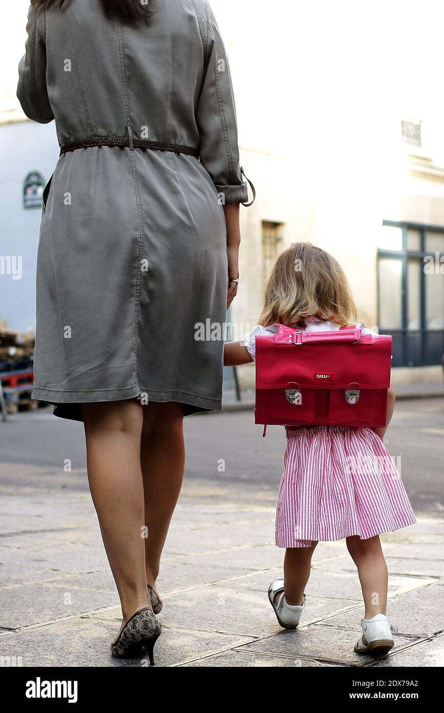 A mother with her daughter arrive to the start of the new school year (rentree scolaire) in the 4th district of Paris, France, on September 02, 2014. Photo by Stephane Lemouton/ABACAPRESS.COM Stock Photo