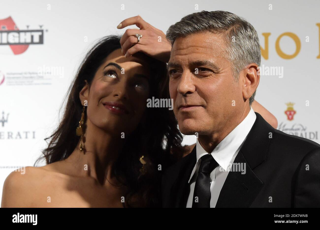 US actor-director George Clooney arrives with his fiancee, British-Lebanese human rights lawyer Amal Alamuddin for the Celebrity Fight Night at the Palazzo Vecchio in Florence, Italy, September 7, 2014. The charity event benefits the Andrea Bocelli Foundation and the Muhammad Ali Parkinson Center. Photo by Eric Vandeville/ABACAPRESS.COM Stock Photo