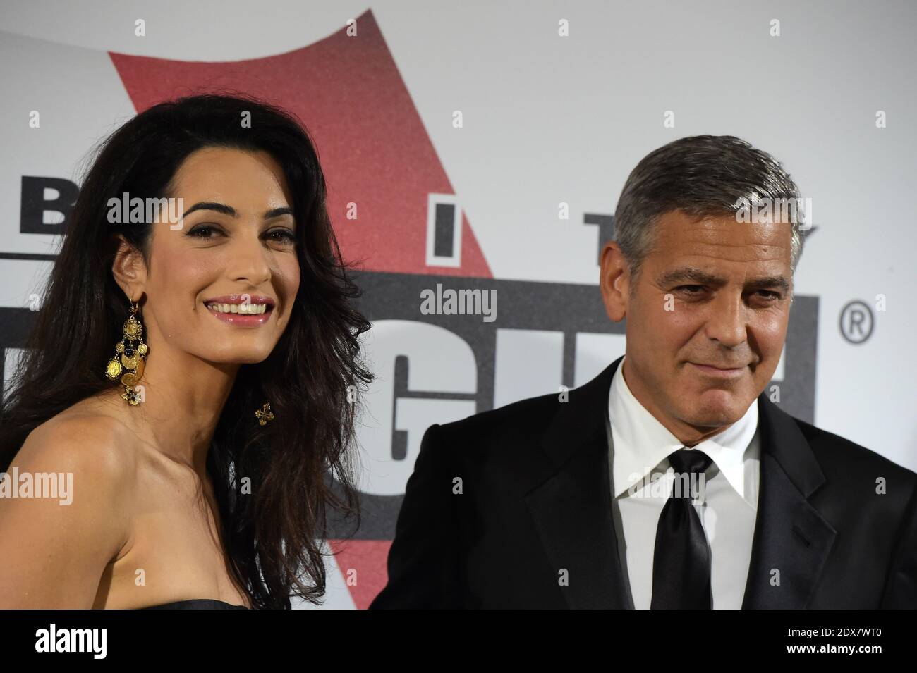 US actor-director George Clooney arrives with his fiancee, British-Lebanese human rights lawyer Amal Alamuddin for the Celebrity Fight Night at the Palazzo Vecchio in Florence, Italy, September 7, 2014. The charity event benefits the Andrea Bocelli Foundation and the Muhammad Ali Parkinson Center. Photo by Eric Vandeville/ABACAPRESS.COM Stock Photo