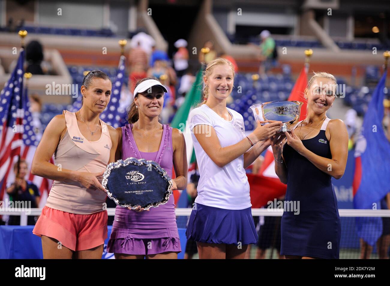 Ekaterina Makarova (2R), Elena Vesnina (R) of Russia, Martina Hingis (2L) of Switzerland and Flavia Pennetta (L) of Italy pose with their trophies after their women's doubles final match on Day Thirteen of the 2014 US Open at the USTA Billie Jean King National Tennis Center on September 6, 2014 in the Flushing neighborhood of the Queens borough of New York City. Makarova and Vesnina defeated Hingis and Pennetta in three sets 2-6, 6-3, 6-2. Photo by CorinneDubreuil/ABACAPRESS.COM Stock Photo