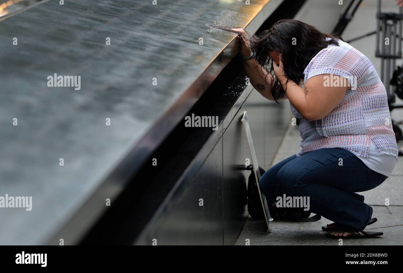 https://c8.alamy.com/comp/2DX8BWD/janice-lynch-of-queens-new-york-pauses-at-the-inscription-of-her-friend-patricia-massanis-name-at-the-north-pool-during-memorial-observances-on-the-13th-anniversary-of-the-911-terror-attacks-at-the-site-of-the-world-trade-center-in-new-york-city-ny-usa-11-september-2014-photo-by-justin-lanepoolabacapresscom-2DX8BWD.jpg