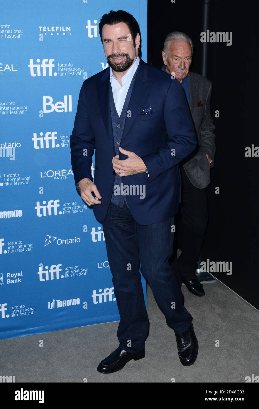 John Travolta attends The photocall at the 2014 Toronto