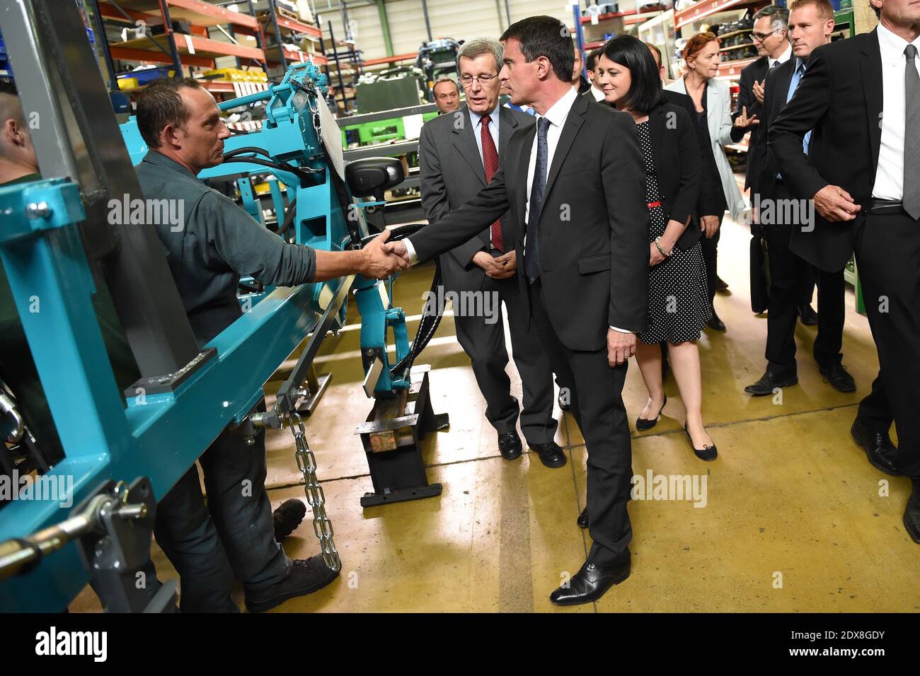 French Prime minister Manuel Valls and French Minister for Housing, Territorial Equality and Rurality Sylvia Pinel visit a 'preciculture' plant, which makes tractors, on September 12, 2014 in Fere Champenoise, France. Photo by Nicolas Gouhier/ABACAPRESS.COM Stock Photo