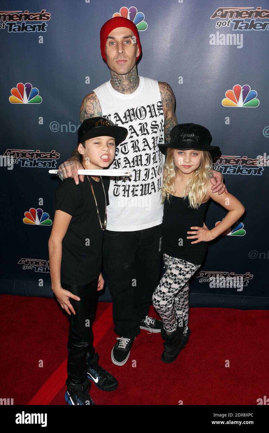 Travis Barker and children Landon Barker and Alabama Barker poses at