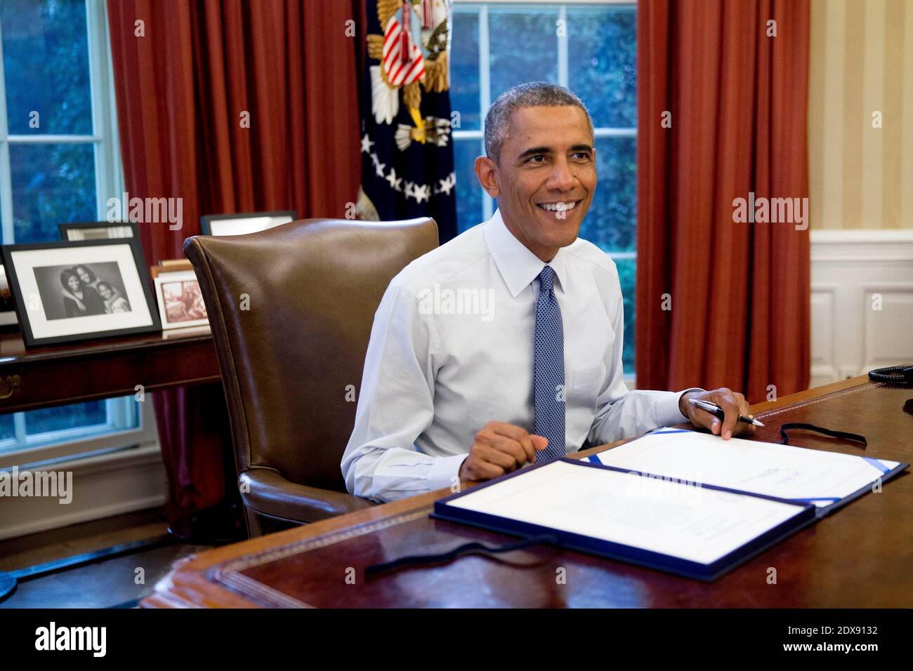President Barack Obama sign H.R. Res. 124, Continuing Appropriations Resolution, 2015, in the Oval Office of the White House in Washington, DC, USA., on Friday, September 19, 2014. Congress bipartisan passage of President Obama plan to arm and train Syrian rebels sets up a broader debate over the use of U.S. military force when lawmakers return after the Nov. 4 election. Yesterday?s 78-22 Senate vote came a day after the House passed the measure. Photo by Andrew Harrer/Pool/ABACAPRESS.COM Stock Photo
