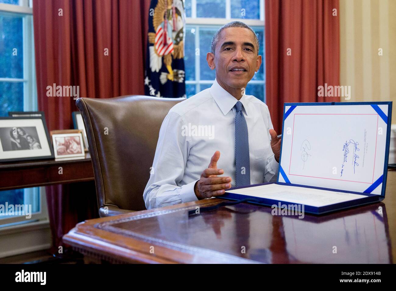 President Barack Obama sign H.R. Res. 124, Continuing Appropriations Resolution, 2015, in the Oval Office of the White House in Washington, DC, USA., on Friday, September 19, 2014. Congress bipartisan passage of President Obama plan to arm and train Syrian rebels sets up a broader debate over the use of U.S. military force when lawmakers return after the Nov. 4 election. Yesterday?s 78-22 Senate vote came a day after the House passed the measure. Photo by Andrew Harrer/Pool/ABACAPRESS.COM Stock Photo