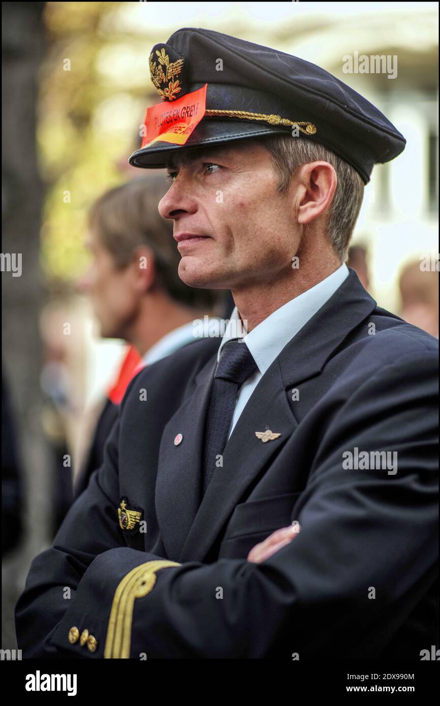 French pilots of Air France company demonstrate near French Parliament in Paris, France, on September 23, 2014. French Prime Minister Manuel Valls speaks out against Air France pilots who are striking for an eighth day over the proposed expansion of its low-cost carrier, Transavia. The strike forced the airline to cancel about 60% of its flights, is undermining its precarious finances, causing a daily operating loss of 20 million euros. Photo by Renaud Khanh/ABACAPRESS.COM Stock Photo