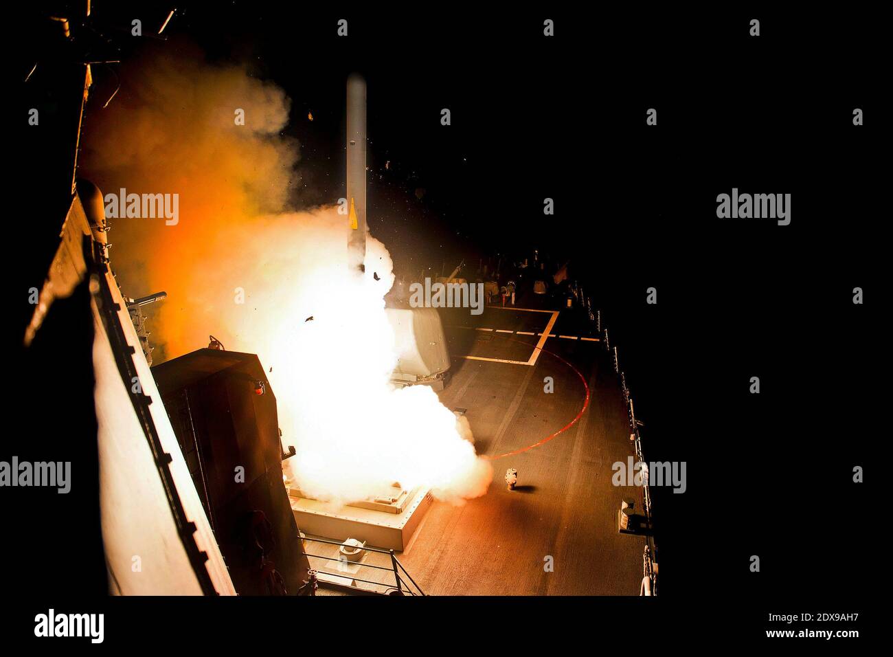 The guided-missile destroyer USS Arleigh Burke (DDG 51) launches Tomahawk cruise missiles. Arleigh Burke is deployed in the U.S. 5th Fleet area of responsibility supporting maritime security operations and theater security cooperation efforts. Red Sea, September 23, 2014. Photo by US Navy via ABACAPRESS.COM Stock Photo