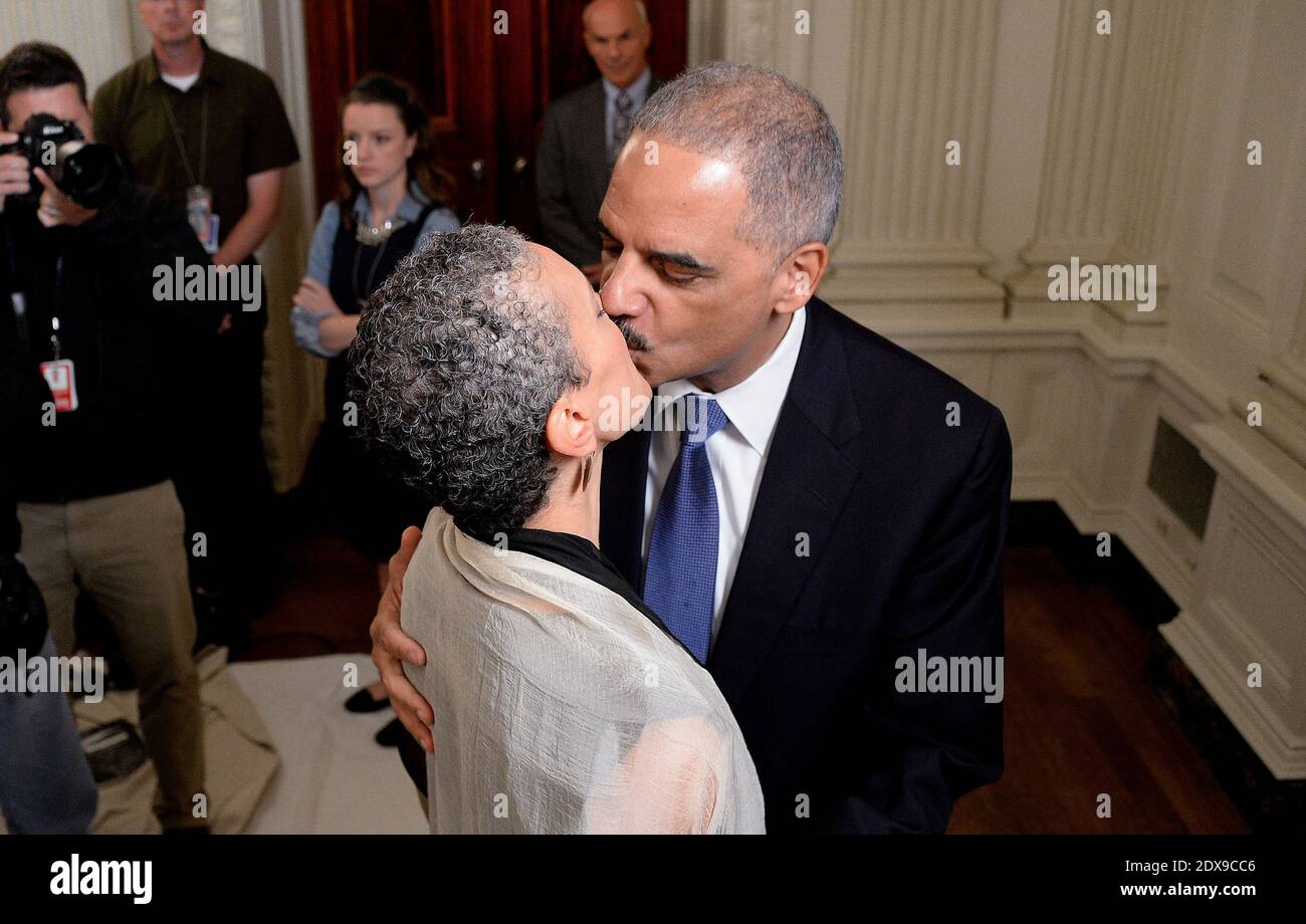 Attorney General Eric Holder kisses his wife Dr. Sharon Malone during a press conference where he annonced his resignation in the State Dining room of the White House in Washington, DC, USA, on September 25, 2014. Photo by Olivier Douliery/ABACAPRESS.COM Stock Photo