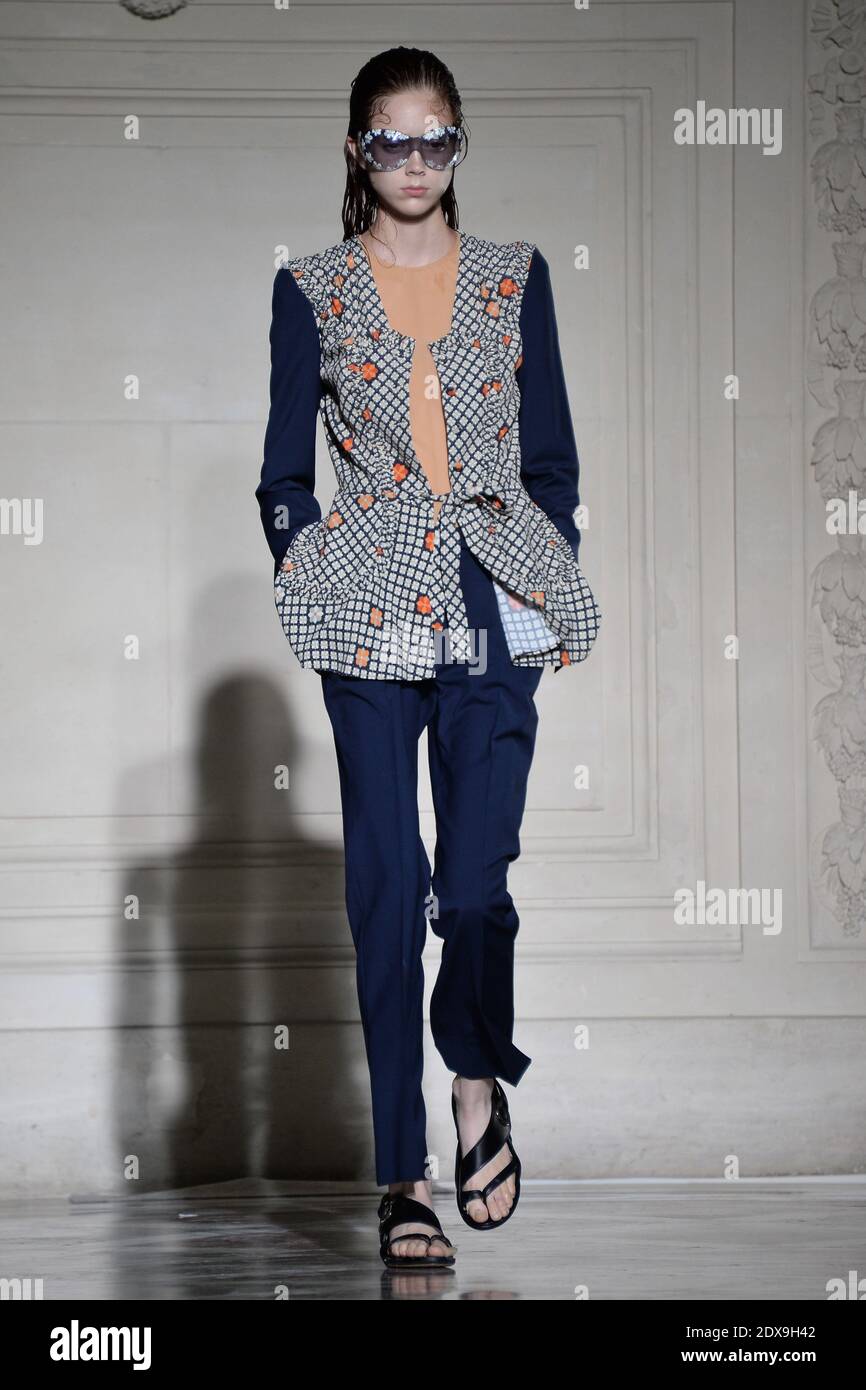 A model displays a creation by designer Raf Simons for his Spring ...