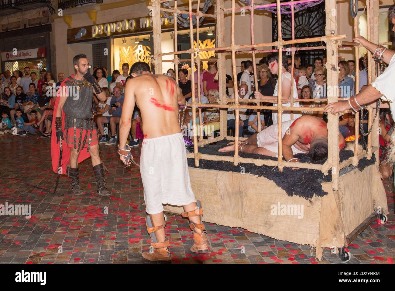 An annual festival in Cartagena, Spain is the Cartaginians and Romans. A triumphal procession by the Romans through the city streets. A caged prisoner Stock Photo