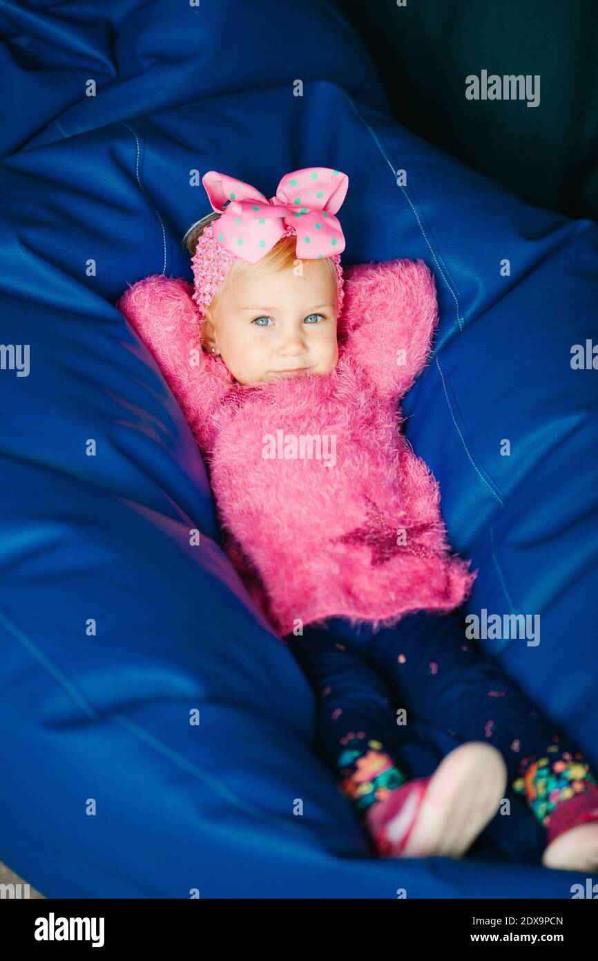 Girl Lying On Bean Bag High Resolution Stock Photography and Images - Alamy