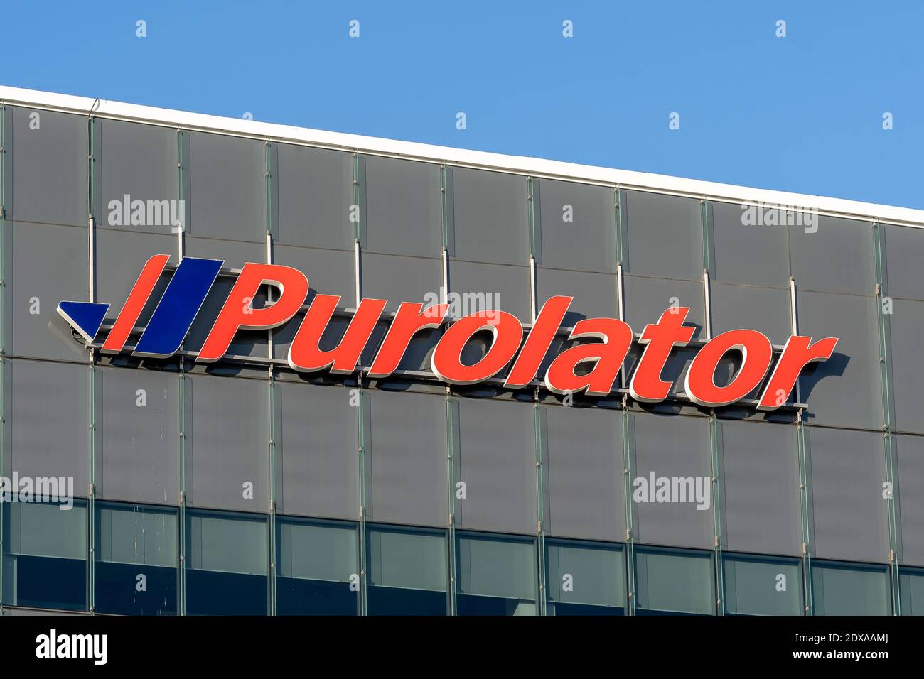 Mississauga, Ontario, Canada - October 23, 2019: Purolator's sign on  their head office building in Mississauga, Ontario, Canada. Stock Photo