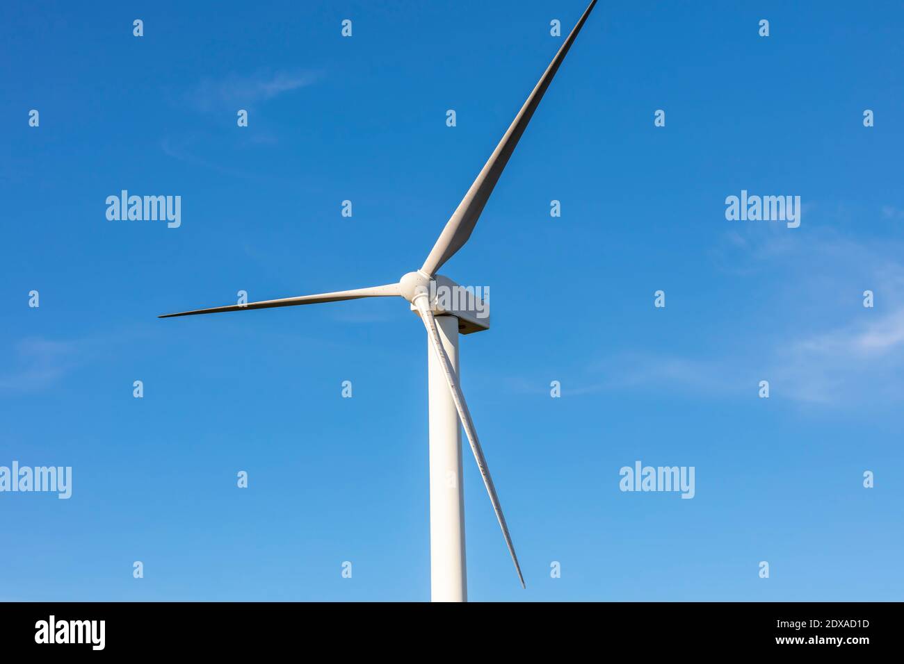 A Large Three Blade Industrial Wind Turbine Generating Electricity In A 