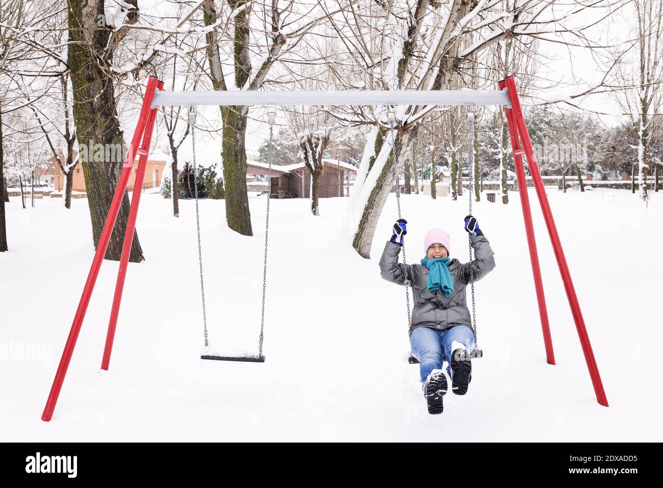 Mature woman swinging in park hi-res stock photography and images - Alamy