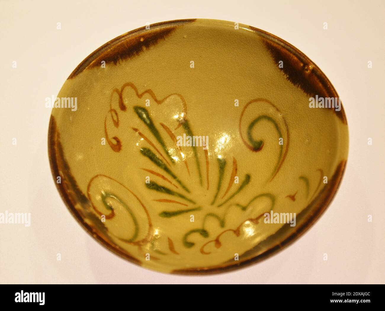 an ancient bowl with bird figure showed in the museum in Shanghai Stock Photo