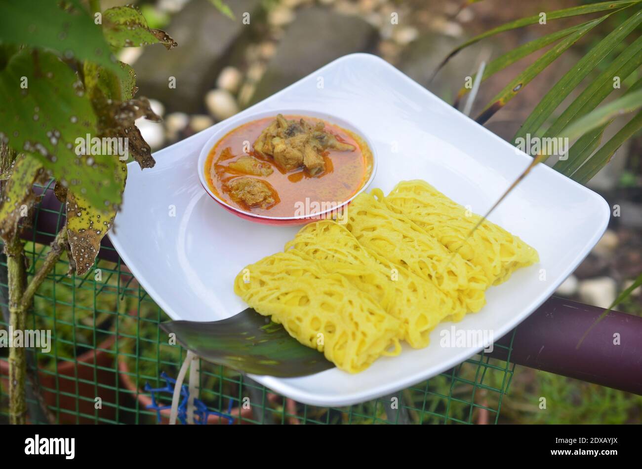 Fluffy Net Bread Or Roti Jala In Malay Local Language Served With Chicken Meat Curry Stock Photo Alamy