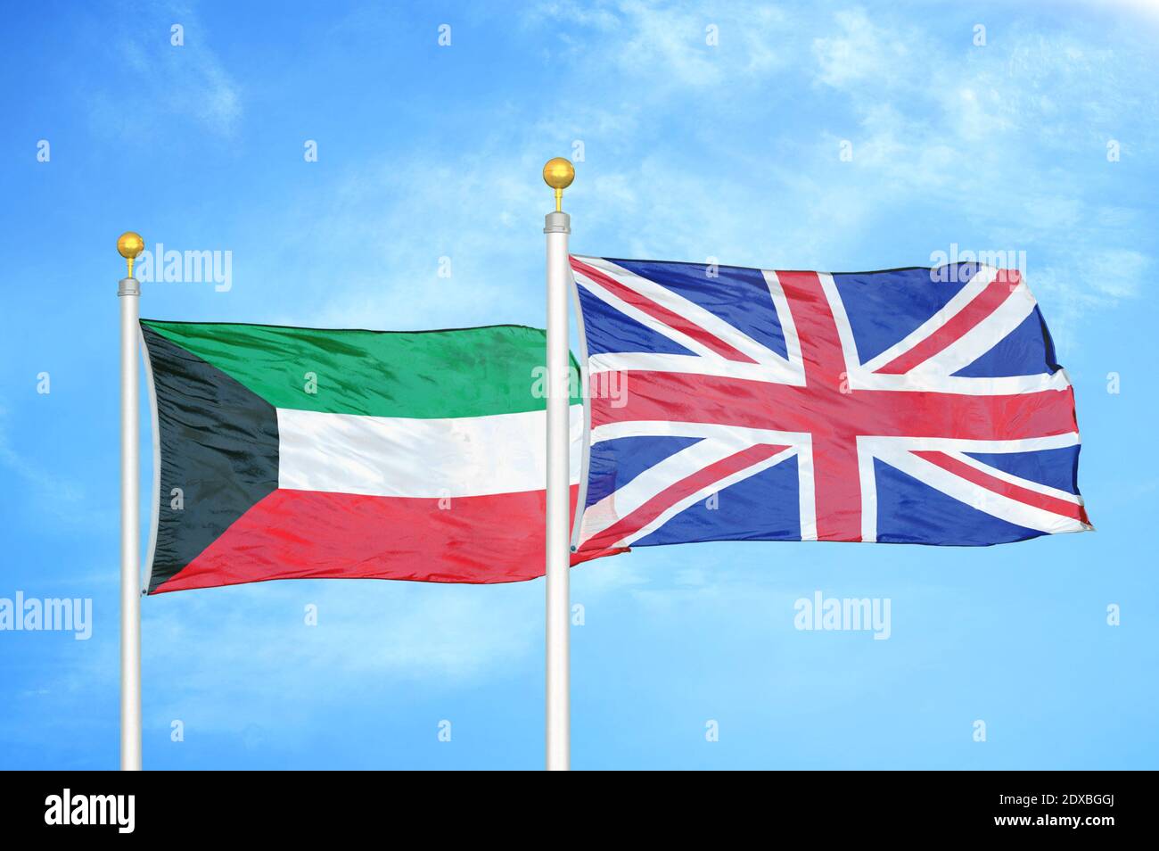 Kuwait and United Kingdom two flags on flagpoles and blue sky Stock Photo