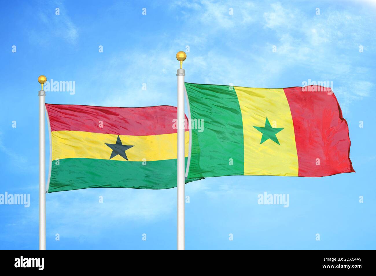 Ghana and Senegal two flags on flagpoles and blue sky Stock Photo