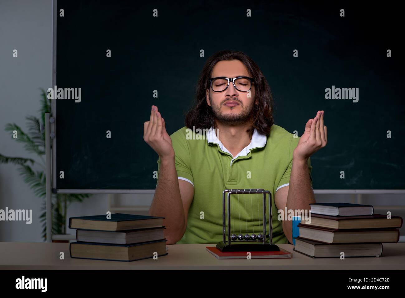 Male student preparing for exams in the classroom Stock Photo