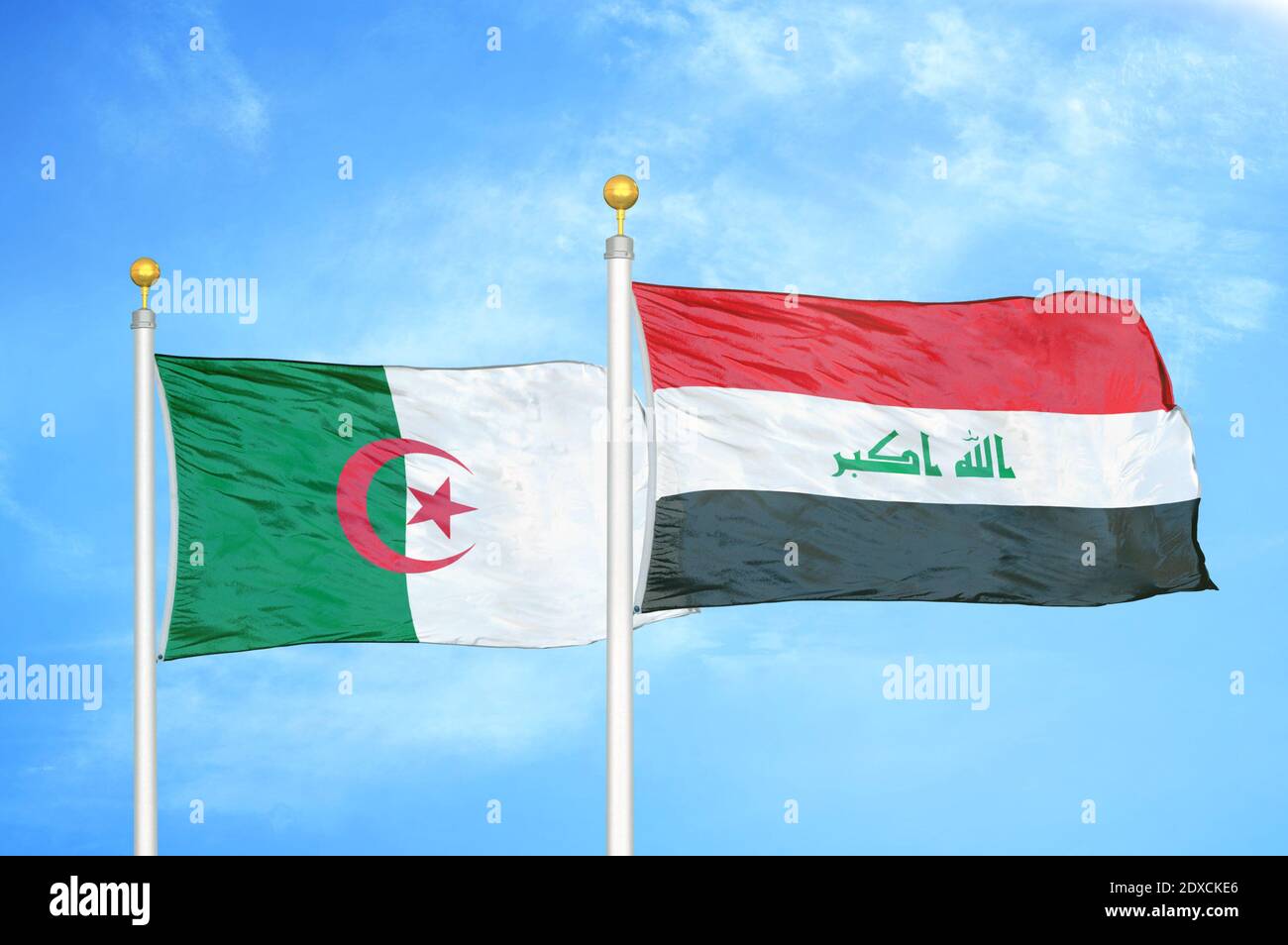 Algeria and Iraq two flags on flagpoles and blue sky Stock Photo