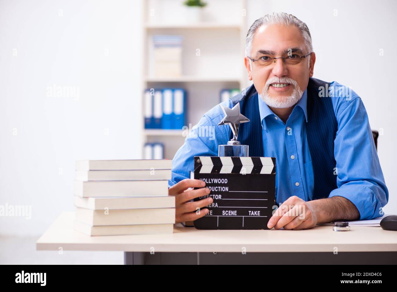 Old male author writing the screenplay Stock Photo - Alamy
