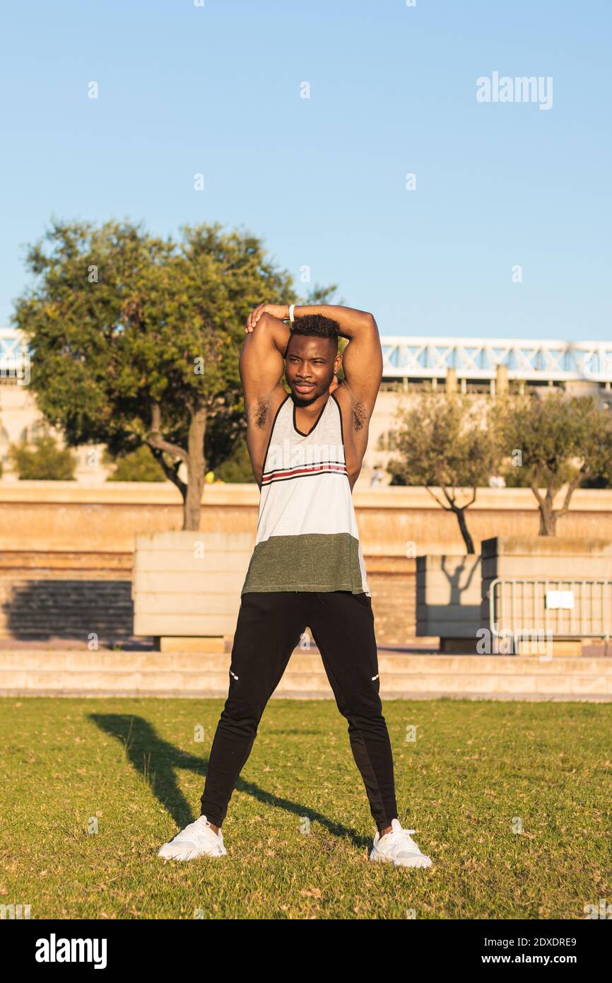 Man stretching arms african hi-res stock photography and images - Alamy
