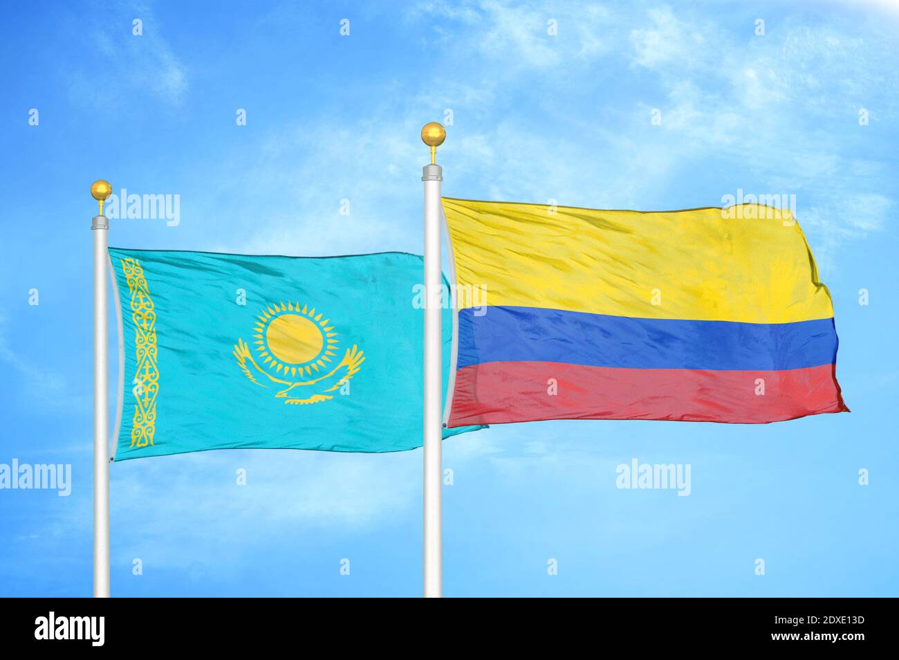 Kazakhstan and Colombia two flags on flagpoles and blue sky Stock Photo