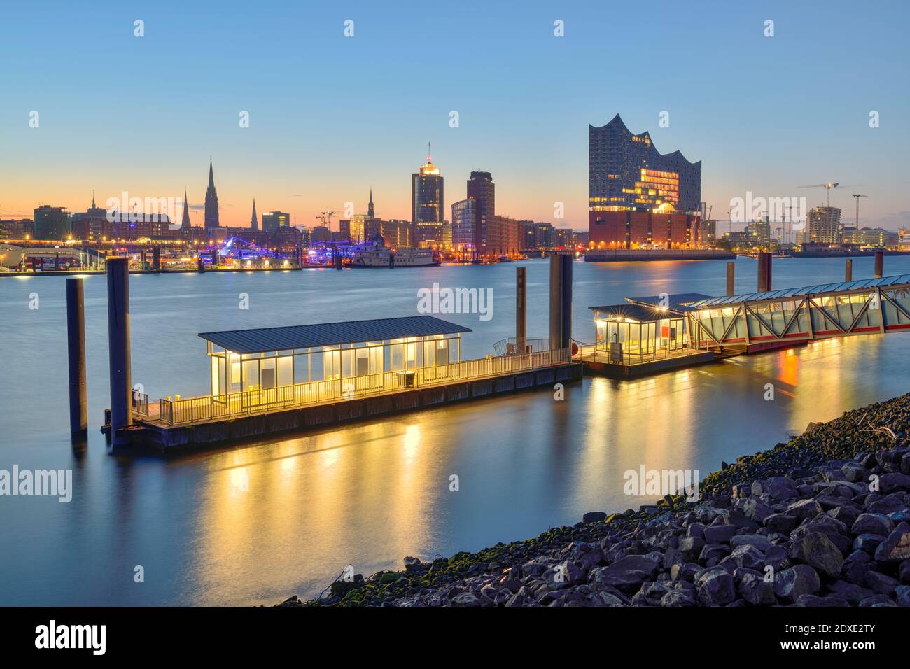 Germany, Hamburg, Northern bank of Elbe at dawn with Elbphilharmonie and city skyline in background Stock Photo