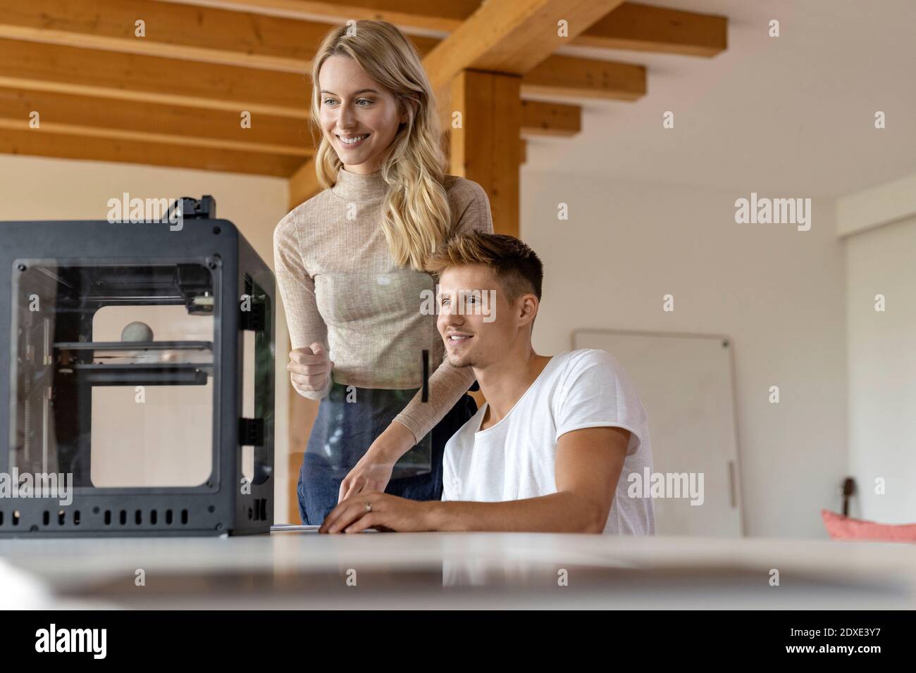 Expertise team working together on 3D printer at home Stock Photo