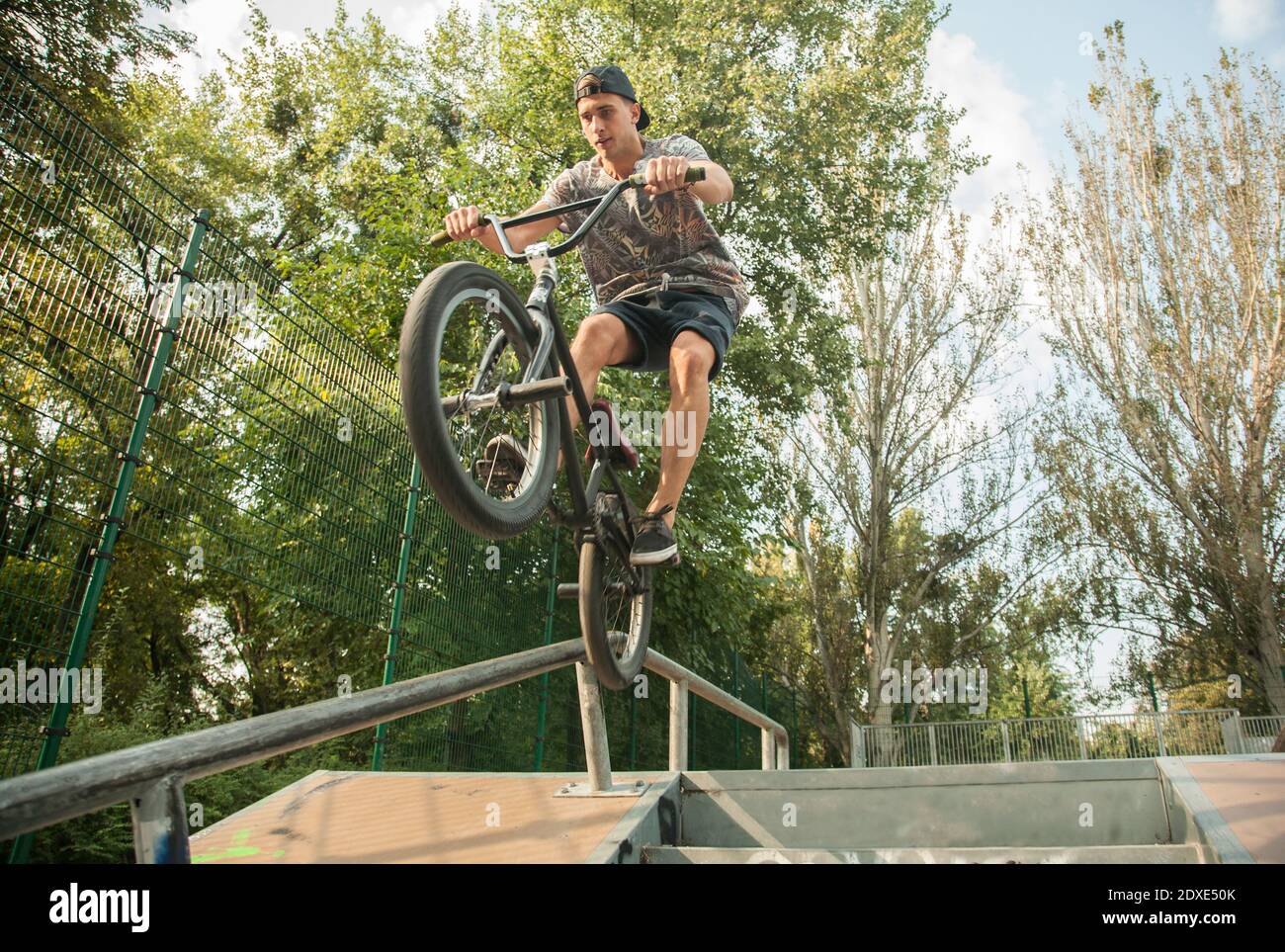 Young man riding BMX bike on jumps in park, Budapest, Hungary Stock Photo -  Alamy